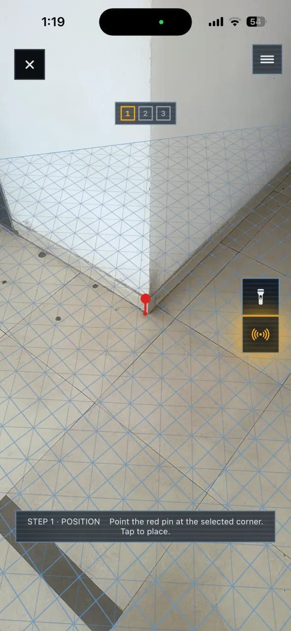 Scanning a real floor and wall corner while DeltaARBIM detects the floor plane.